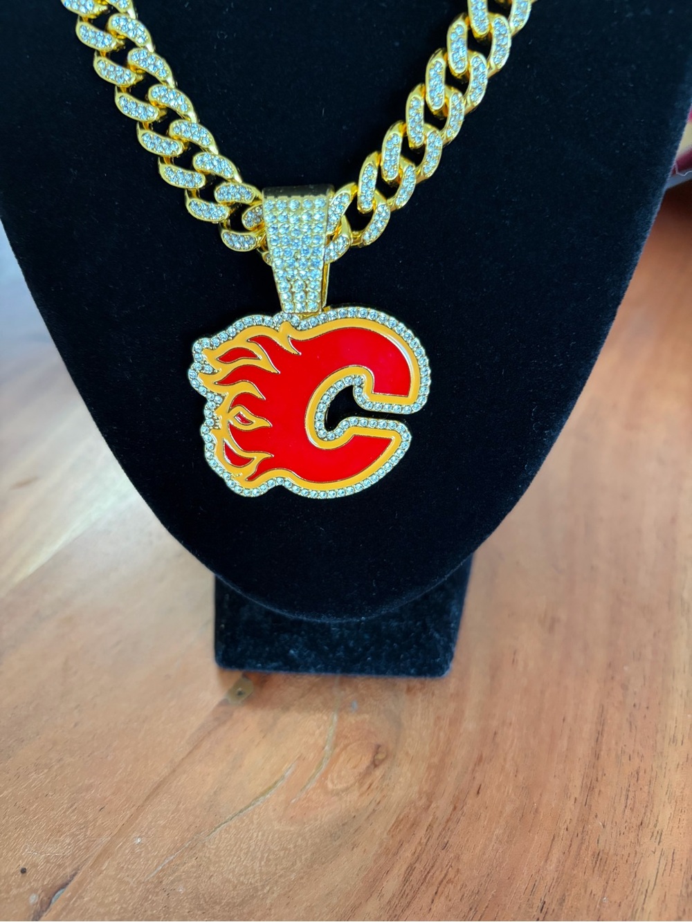 Iced Out Calgary Flames Pendant with Gold Tone Necklace
